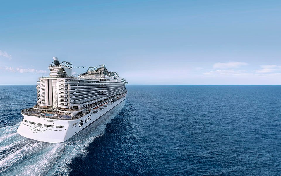 The MSC Seaview cruise ship sailing on a calm ocean under a clear blue sky | MSC Cruises