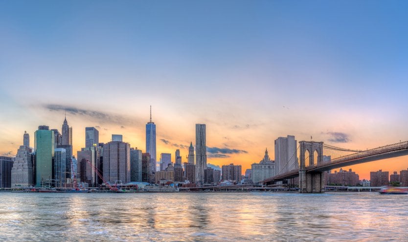 New York City skyline with Brooklyn Bridge at sunset | MSC Cruises New York City skyline with Brooklyn Bridge at sunset | MSC Cruises
