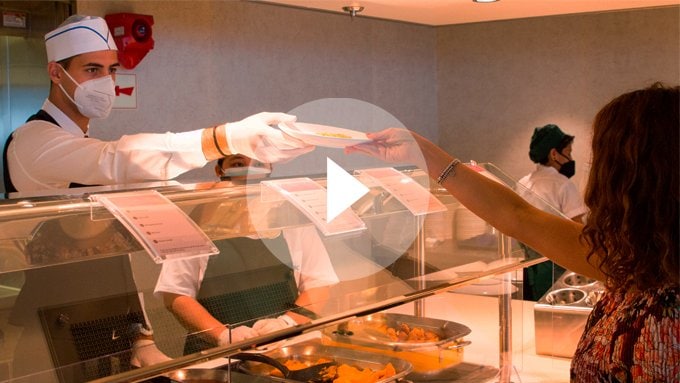 A guest receiving a meal from a buffet on an MSC cruise ship | MSC Cruises A guest receiving a meal from a buffet on an MSC cruise ship | MSC Cruises