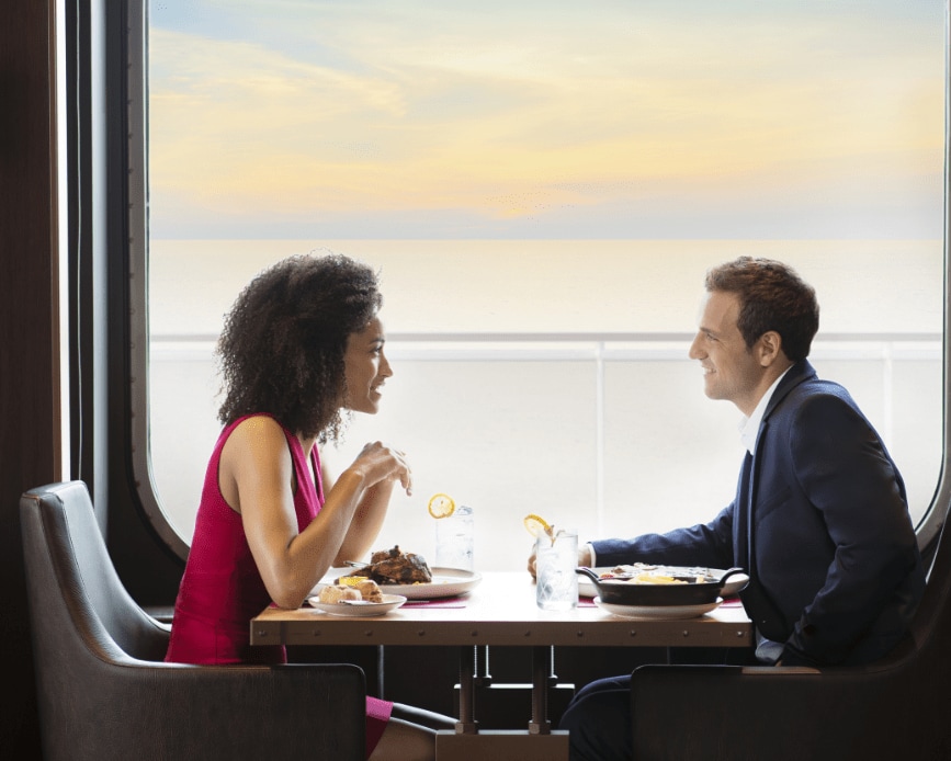 A man and woman dining on board MSC Cruises ship MSC Grandiosa. A man and woman dining on board MSC Cruises ship MSC Grandiosa.