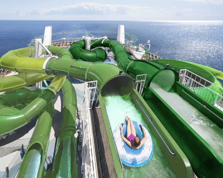 Person an inner tube about to go down a winding water slide on MSC Cruises ship MSC Grandiosa. Person an inner tube about to go down a winding water slide on MSC Cruises ship MSC Grandiosa.