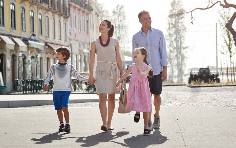 A family walking together in a charming European port town | MSC Cruises A family walking together in a charming European port town | MSC Cruises