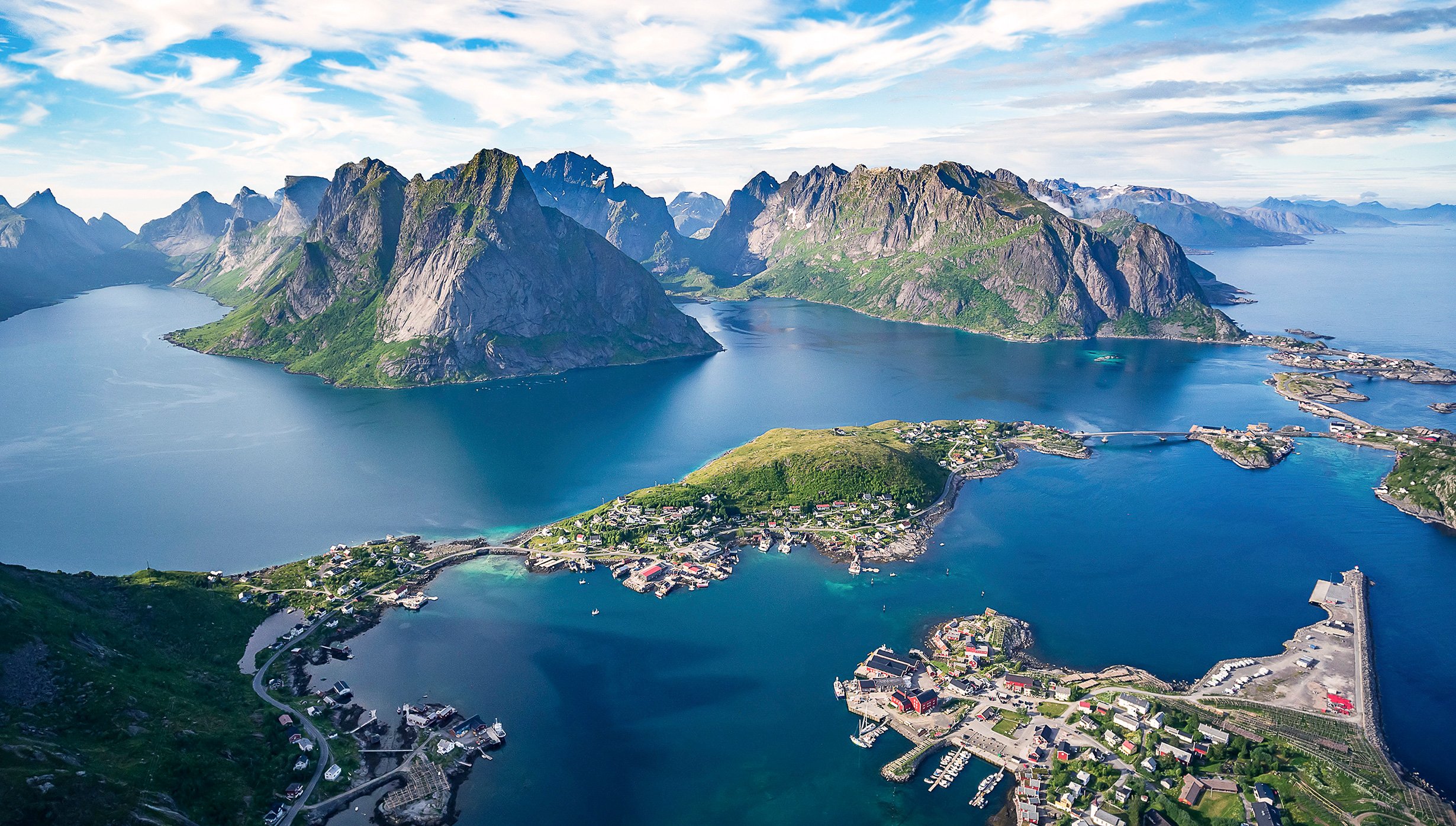 Aerial view of Norway's Lofoten Islands with dramatic peaks and coastal villages | MSC Cruises
