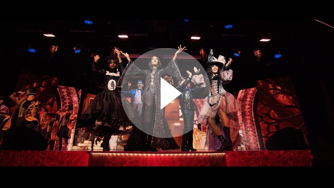 Performers in elaborate costumes on a brightly lit stage during an onboard show | MSC Cruises Performers in elaborate costumes on a brightly lit stage during an onboard show | MSC Cruises