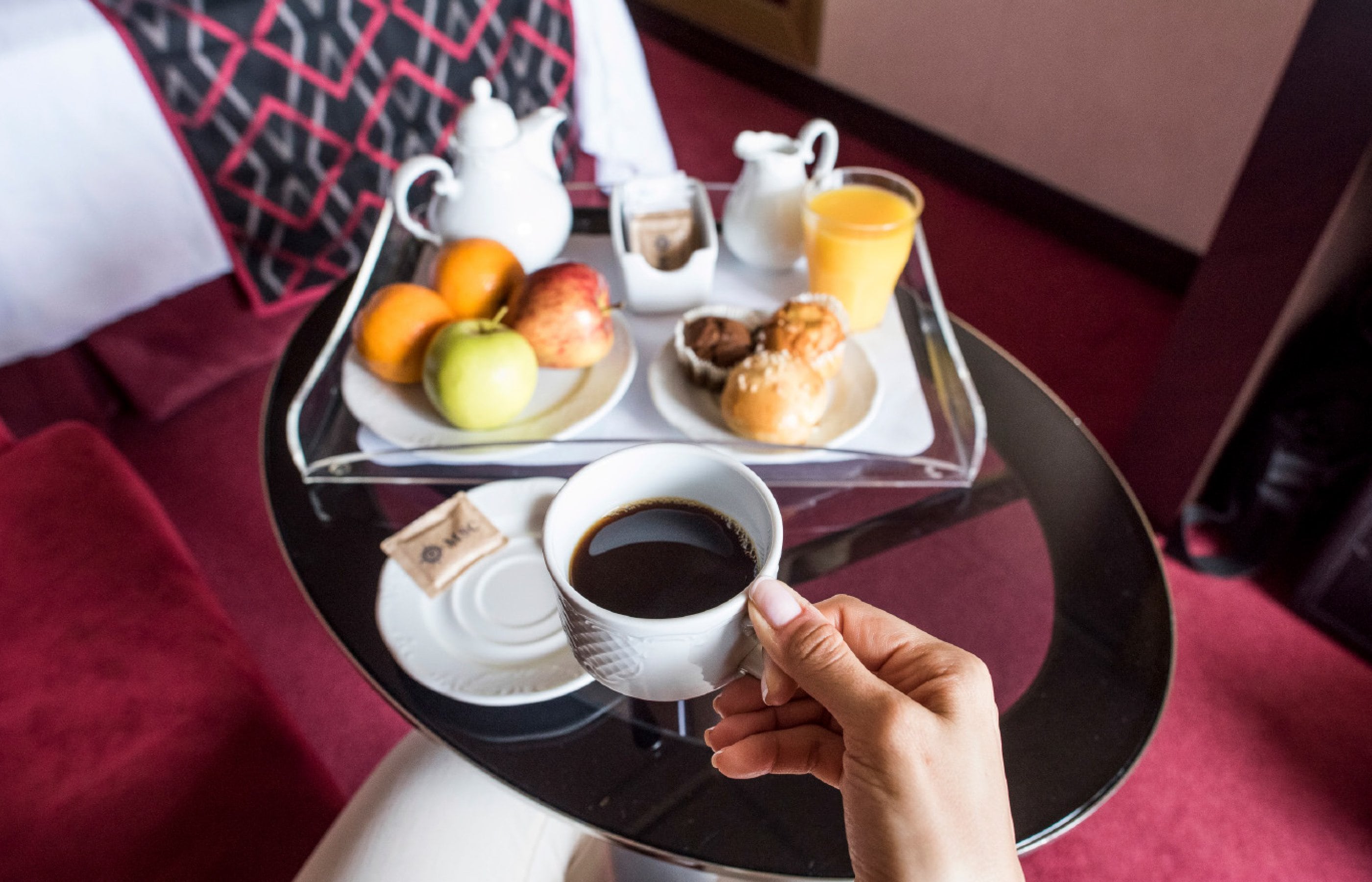 A breakfast tray with coffee, pastries, fruit, and juice in a cruise cabin | MSC Cruises A breakfast tray with coffee, pastries, fruit, and juice in a cruise cabin | MSC Cruises