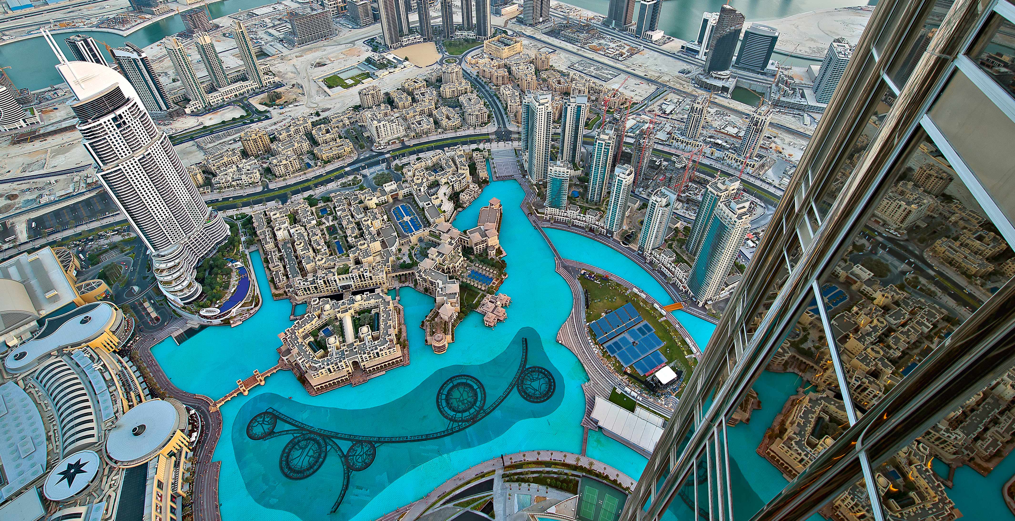 Aerial view of Dubai's Burj Khalifa area with skyscrapers and the Dubai Fountain | MSC Cruises