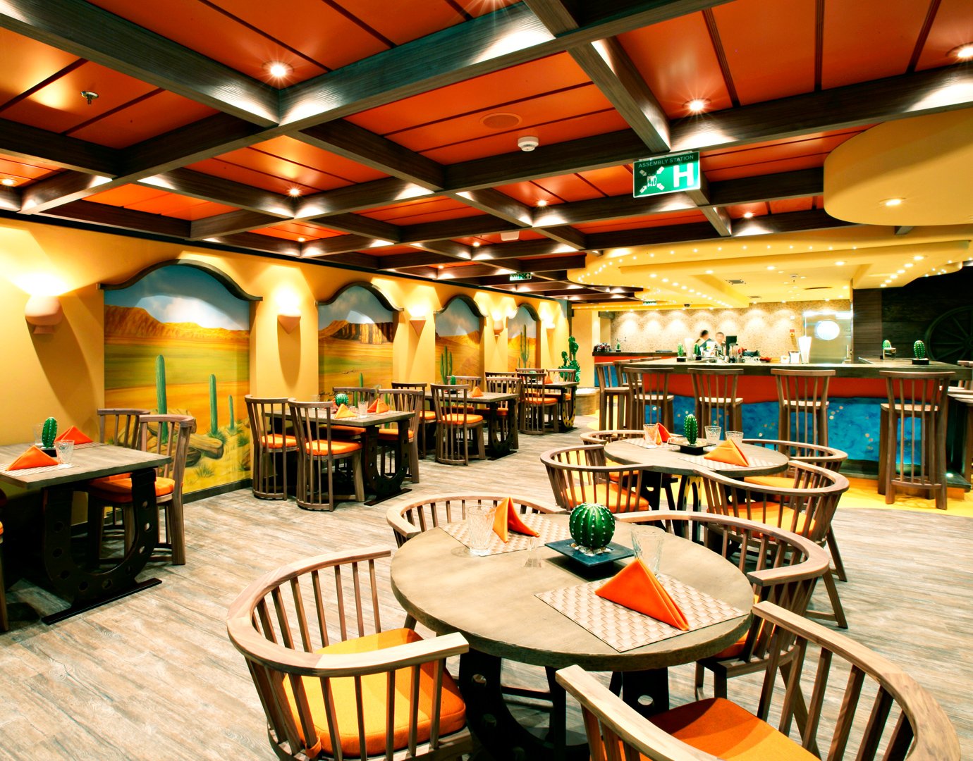 A vibrant Mexican-themed restaurant onboard with colorful decor and cozy seating | MSC Cruises A vibrant Mexican-themed restaurant onboard with colorful decor and cozy seating | MSC Cruises