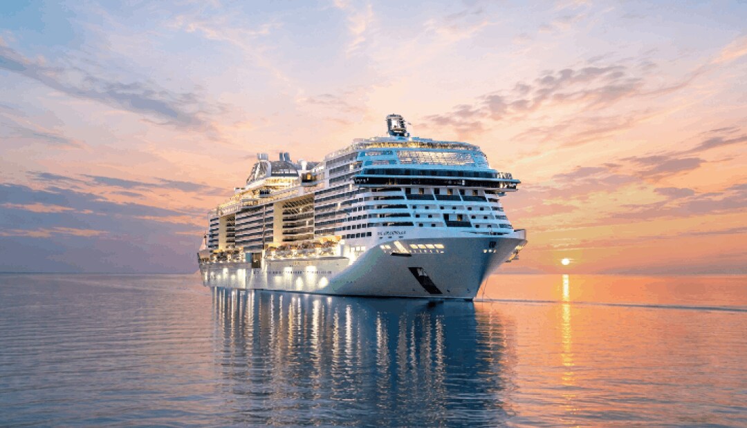 MSC Grandiosa cruise ship sailing on open water at dusk