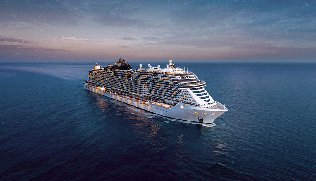 MSC Seashore cruise ship sailing on open water at dusk